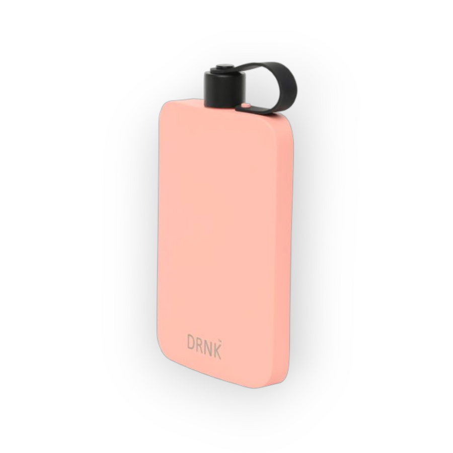 Coral Pink DRNK Slim flat stainless steel water bottle, angled view